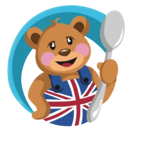 Miś z łyżką w ubraniu z flagą Wielkiej Brytanii